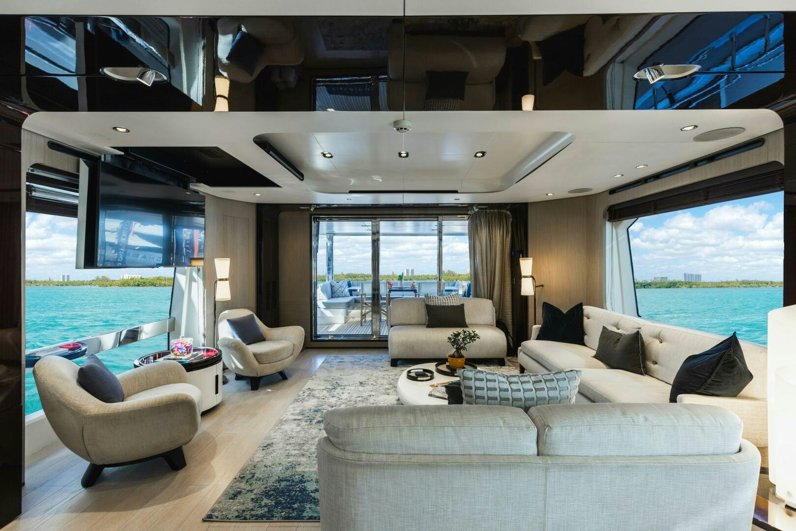 a living room with a large swimming pool aboard MAJESTIC MOMENTS Yacht for Sale