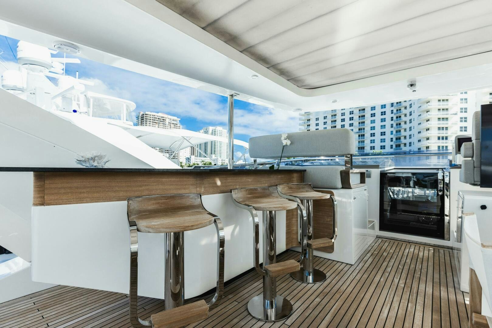 a room with a table and chairs aboard MAJESTIC MOMENTS Yacht for Sale