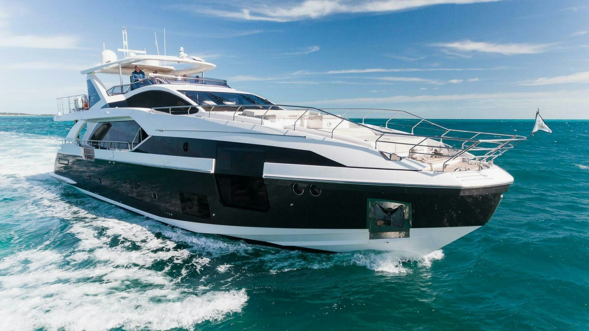 a white yacht on the water aboard MAJESTIC MOMENTS Yacht for Sale