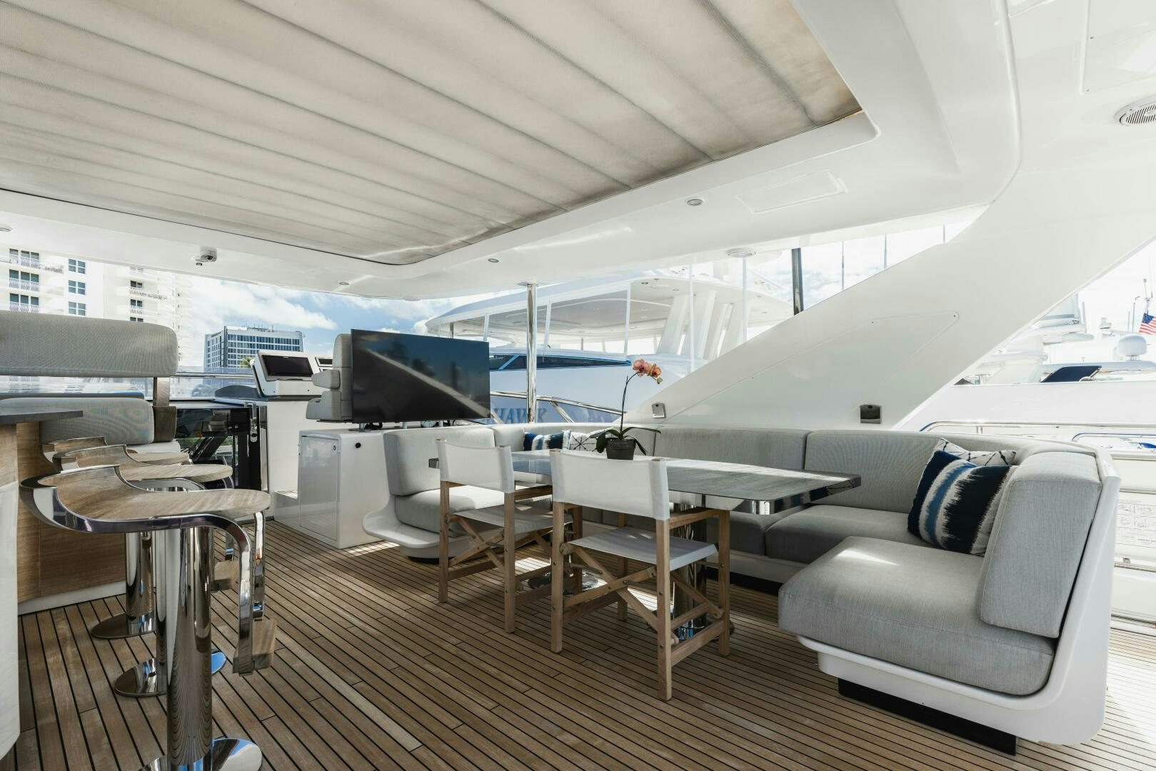 a room with a couch and a table and chairs aboard MAJESTIC MOMENTS Yacht for Sale