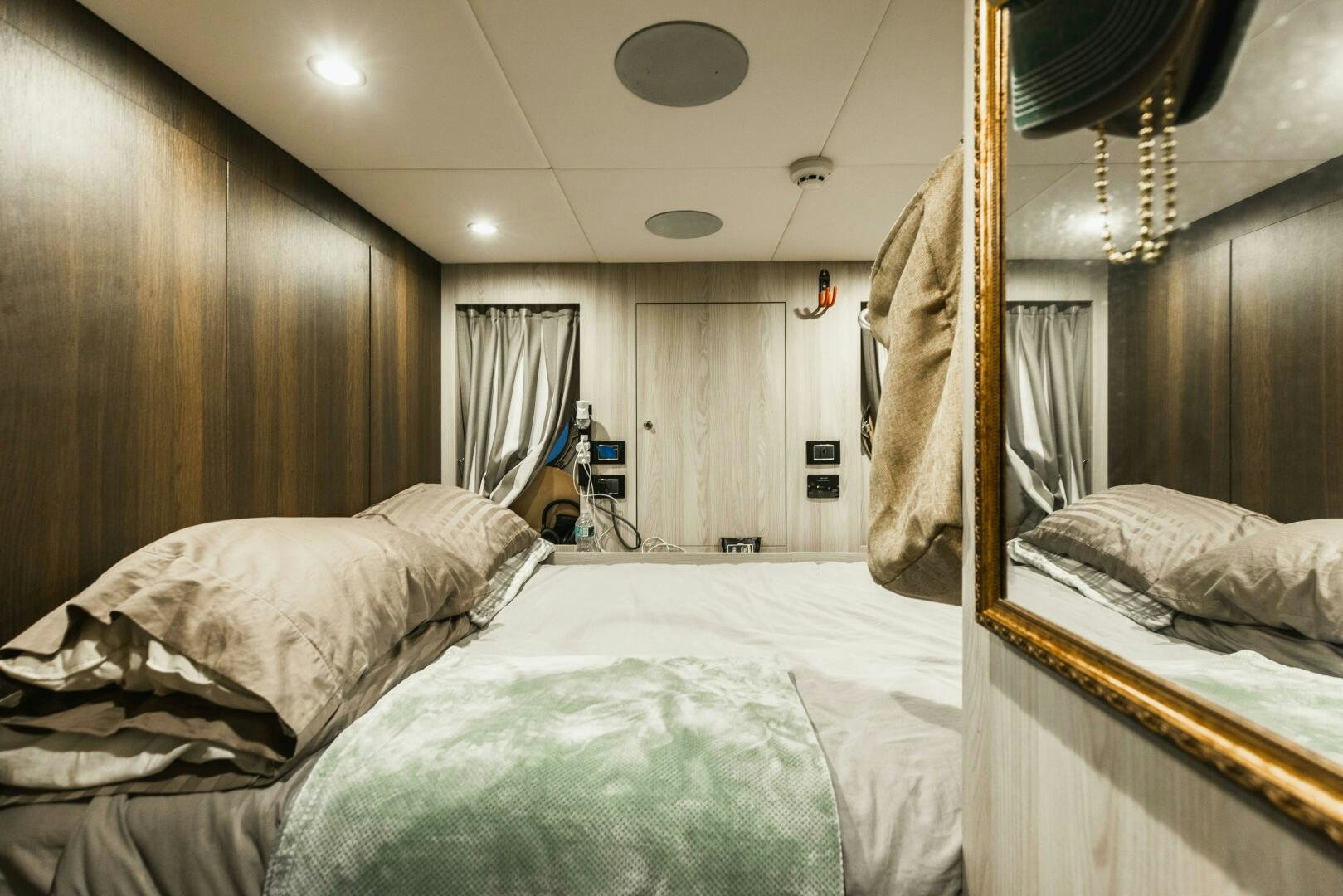 a person playing a guitar in a bedroom aboard MAJESTIC MOMENTS Yacht for Sale