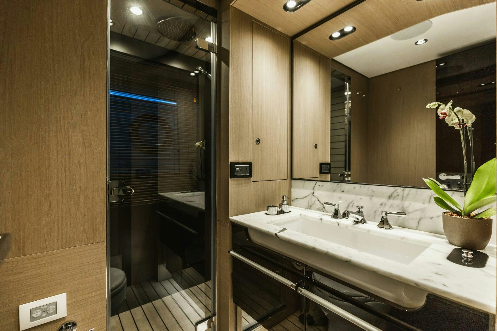 a bathroom with a large mirror aboard MAJESTIC MOMENTS Yacht for Sale