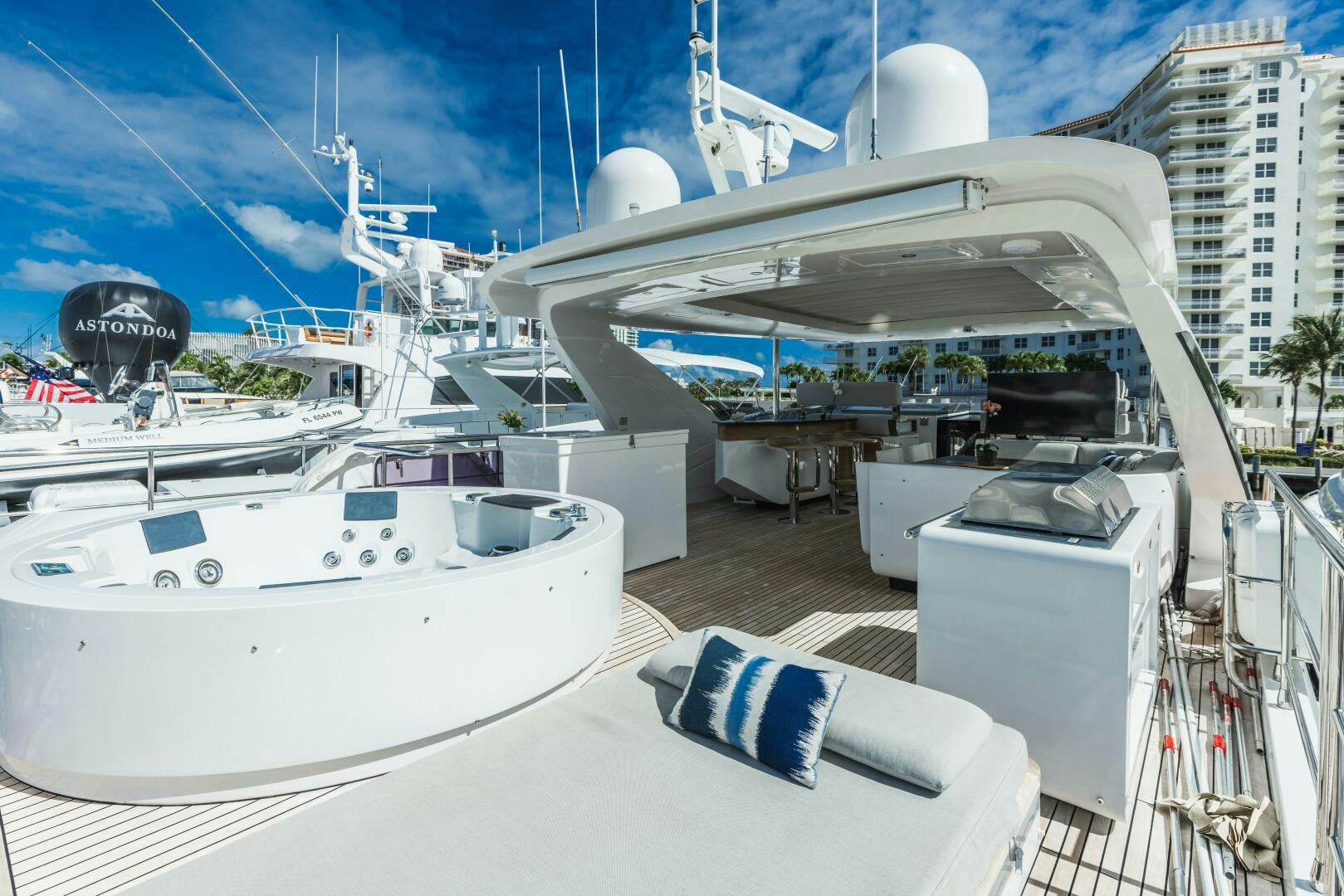 a large white boat in a harbor aboard MAJESTIC MOMENTS Yacht for Sale
