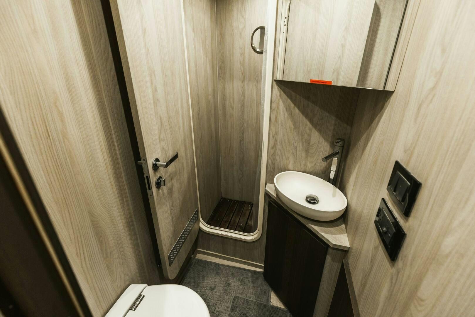 a bathroom with a sink and toilet aboard MAJESTIC MOMENTS Yacht for Sale