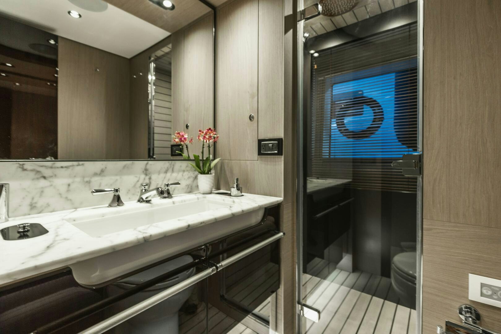 a bathroom with a large mirror aboard MAJESTIC MOMENTS Yacht for Sale