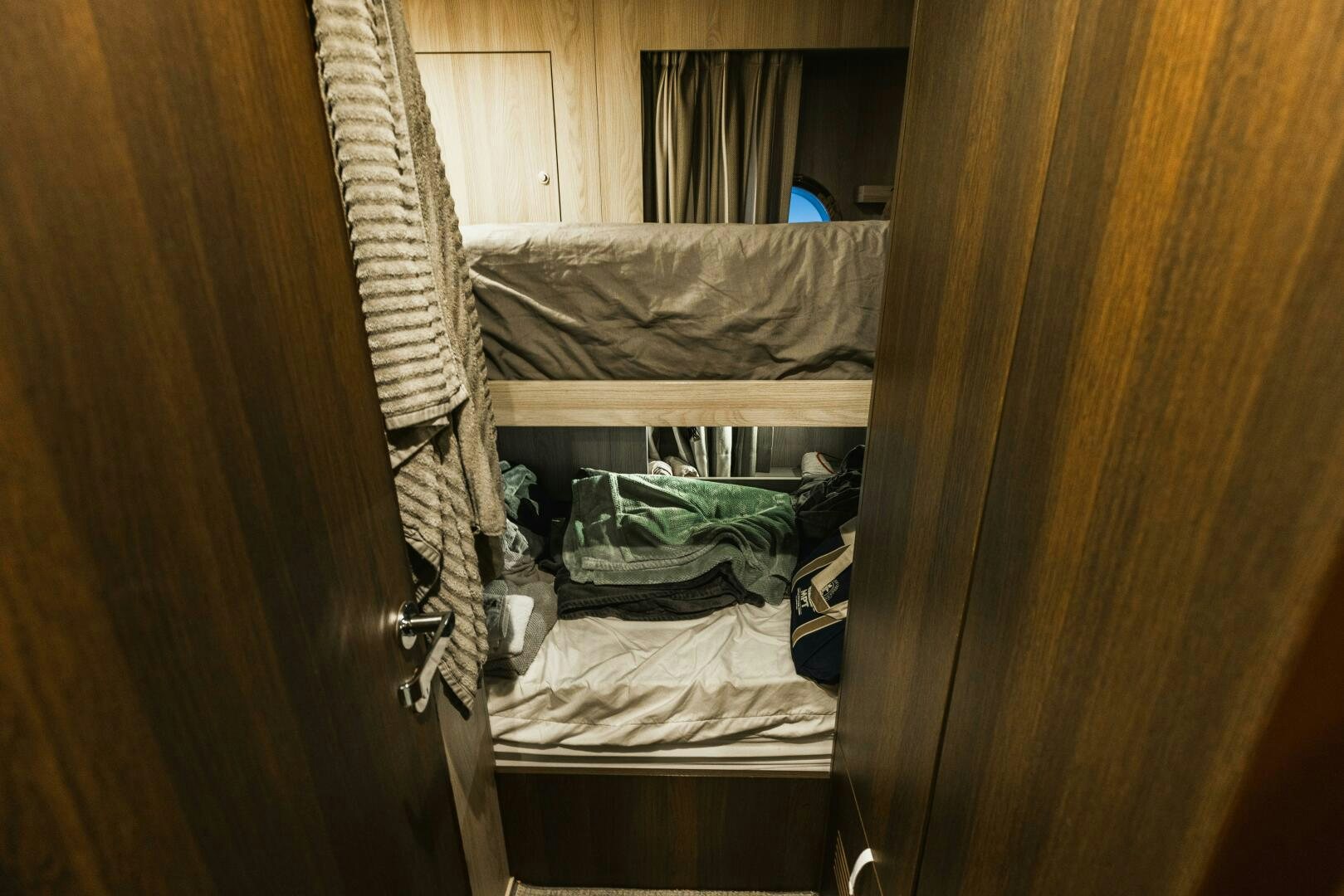 a closet with clothes and clothes aboard MAJESTIC MOMENTS Yacht for Sale