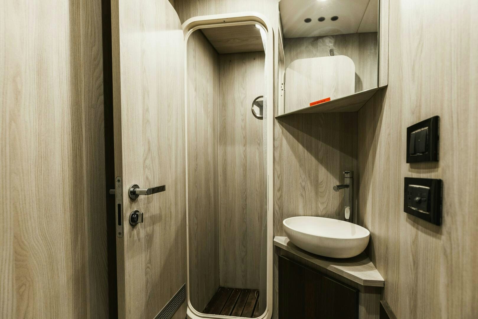 a bathroom with a sink and a mirror aboard MAJESTIC MOMENTS Yacht for Sale