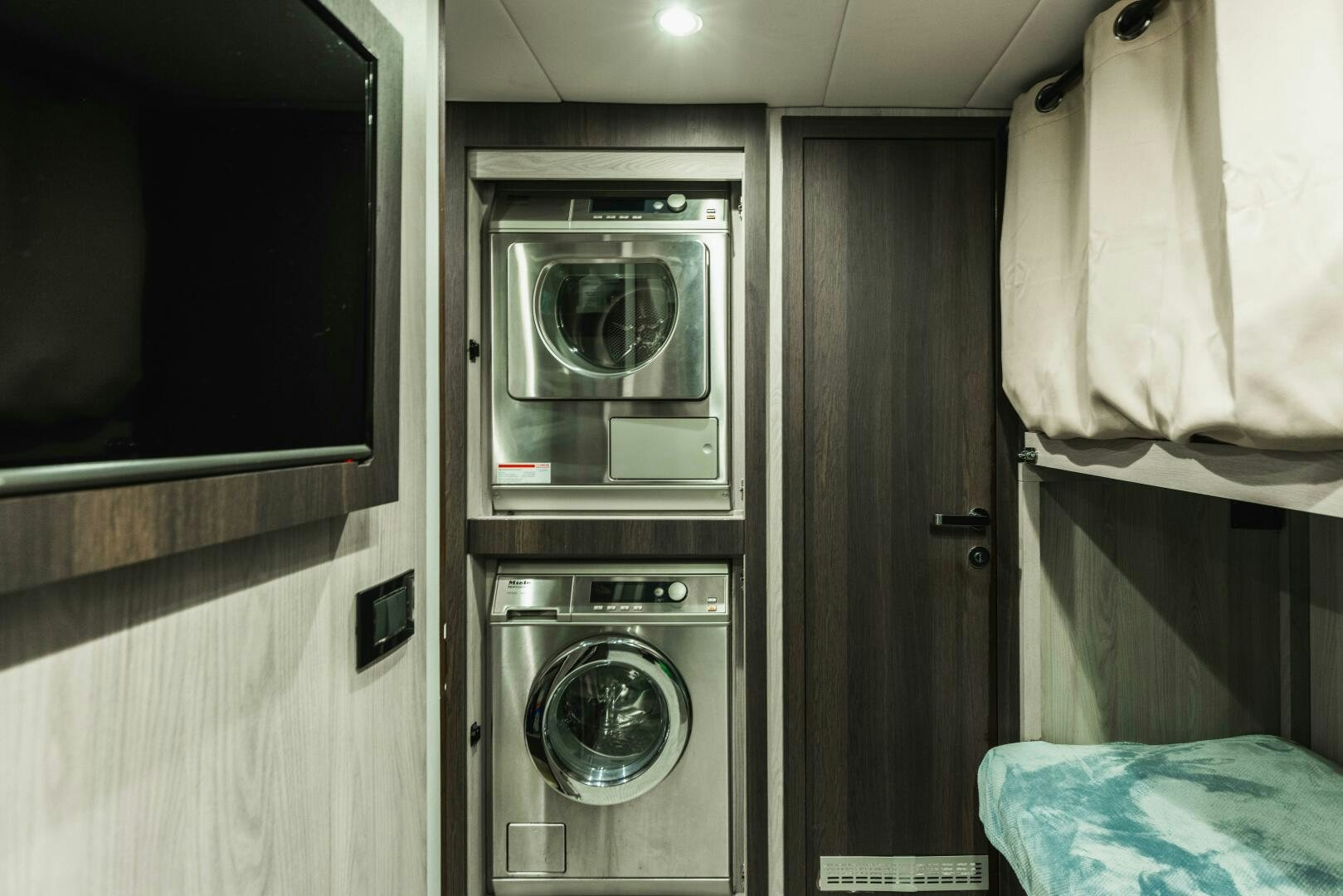 a washer and dryer in a room aboard MAJESTIC MOMENTS Yacht for Sale