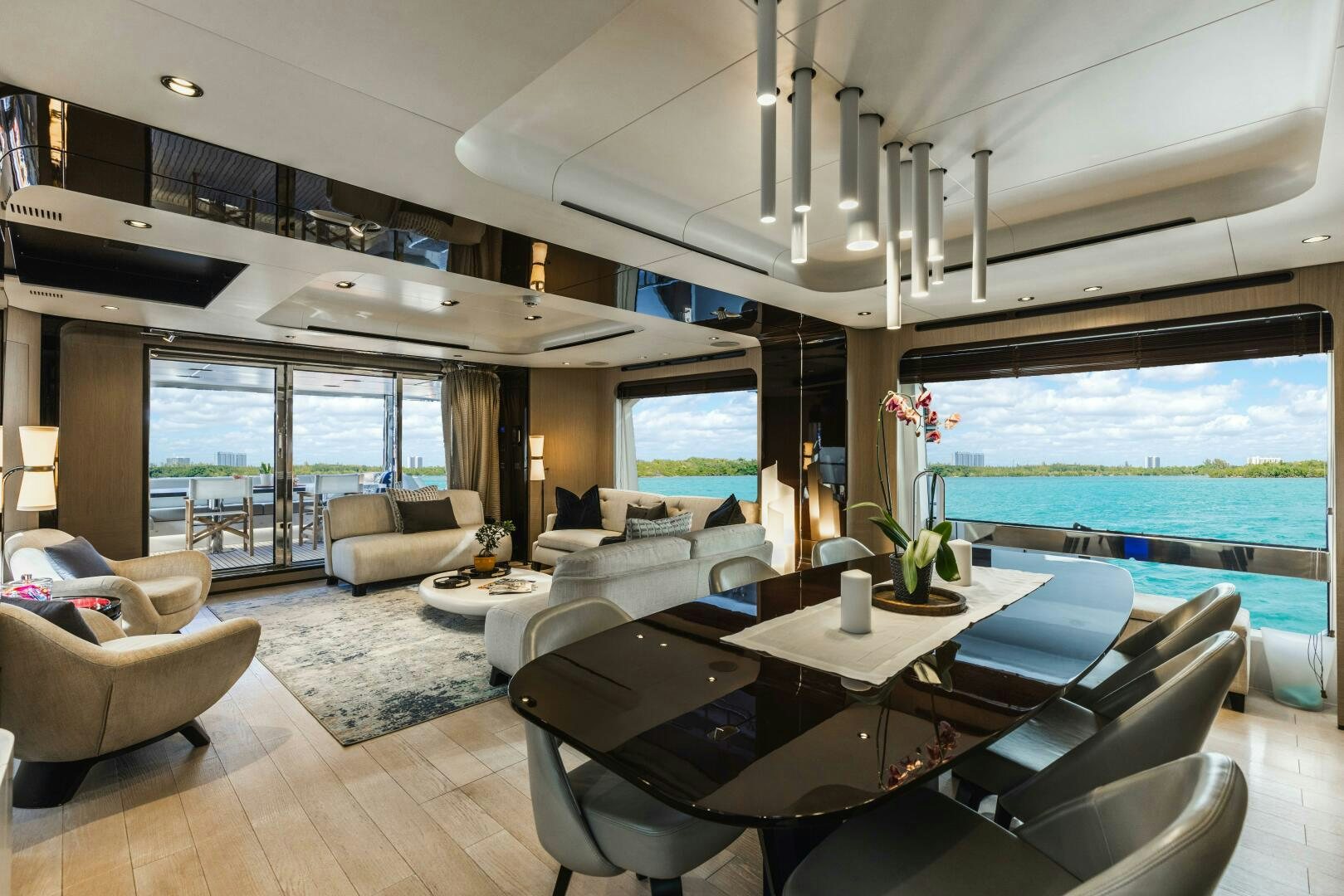 a living room with a large window aboard MAJESTIC MOMENTS Yacht for Sale