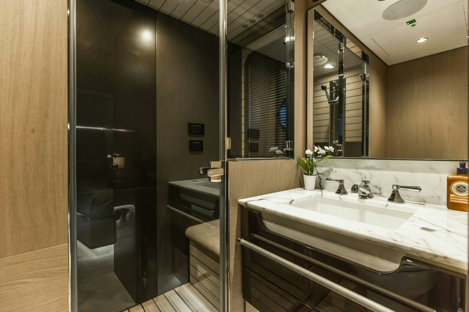 a bathroom with a large mirror aboard MAJESTIC MOMENTS Yacht for Sale