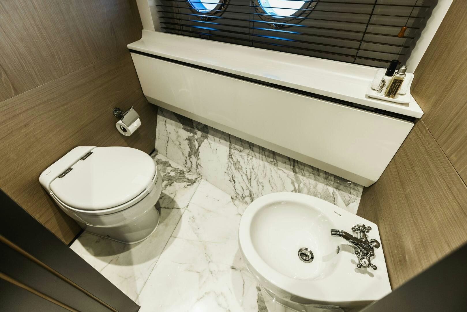 a bathroom with a sink and a toilet aboard MAJESTIC MOMENTS Yacht for Sale