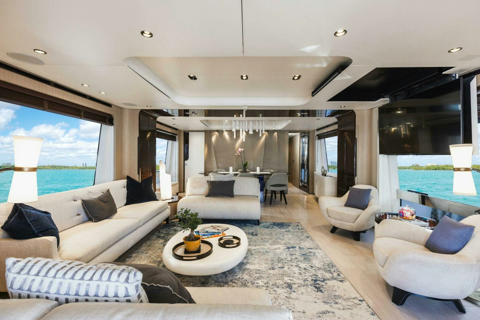 a living room with a large window aboard MAJESTIC MOMENTS Yacht for Sale