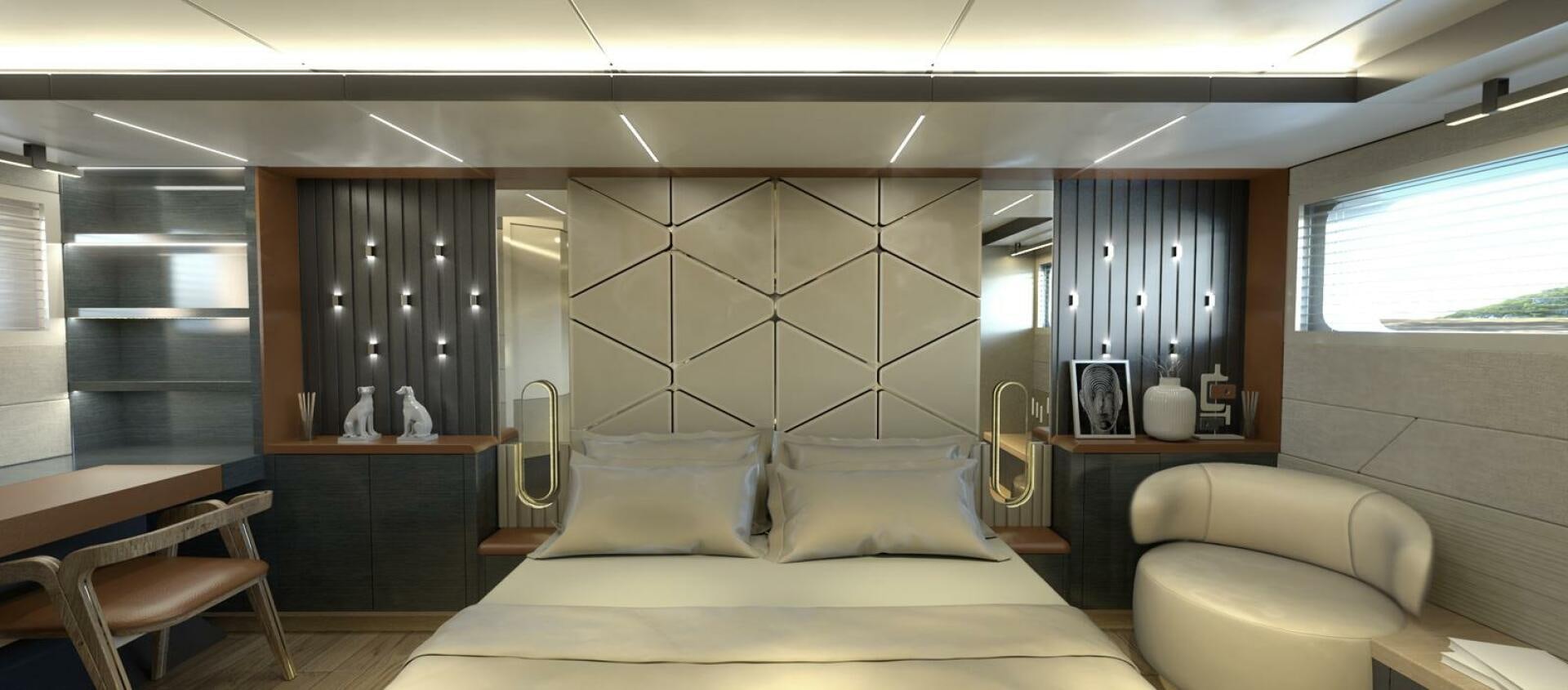 a bedroom with a bed and a desk aboard VOYAGE ONE Yacht for Charter