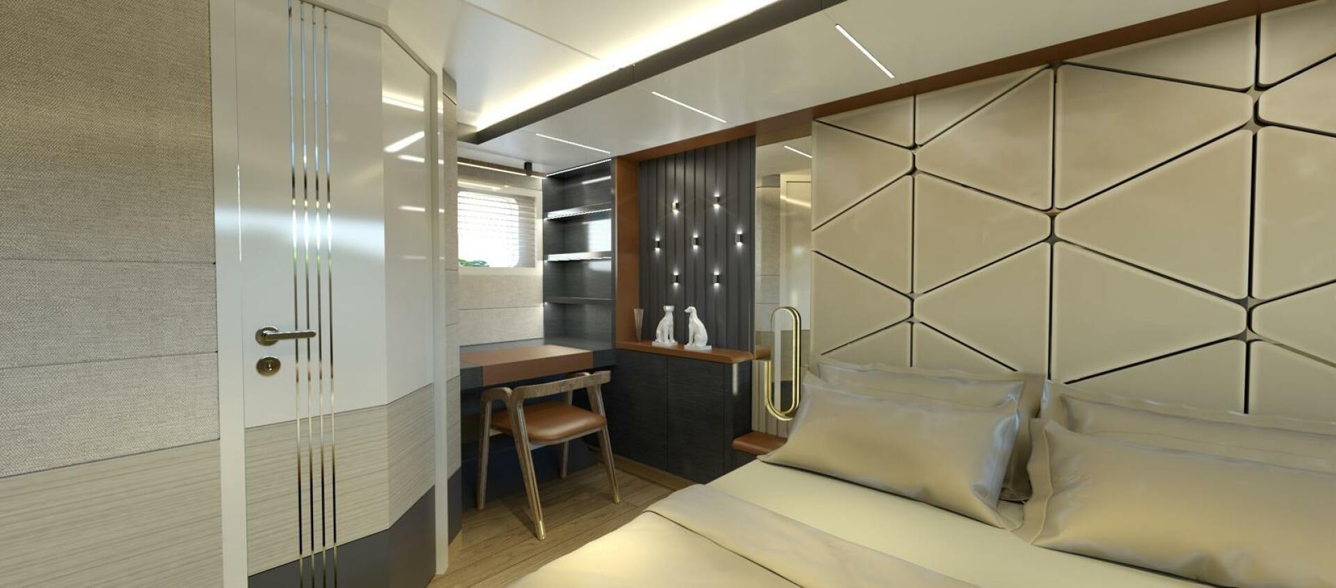 a room with a bed and a desk aboard VOYAGE ONE Yacht for Charter