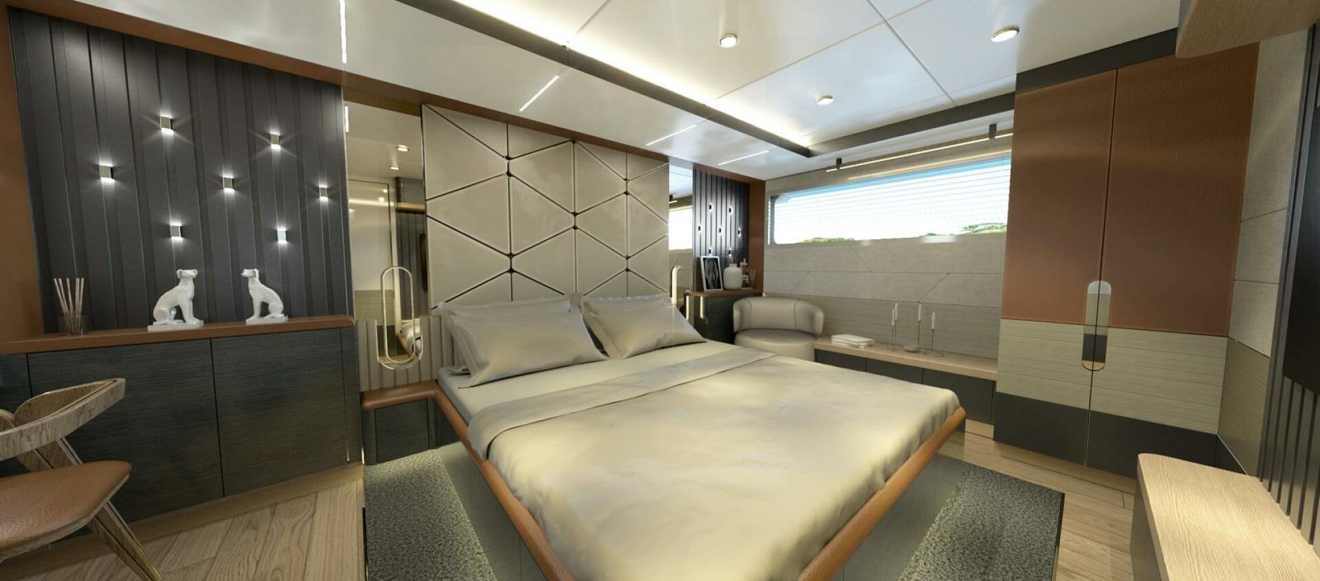 a room with a bed and a desk aboard VOYAGE ONE Yacht for Charter