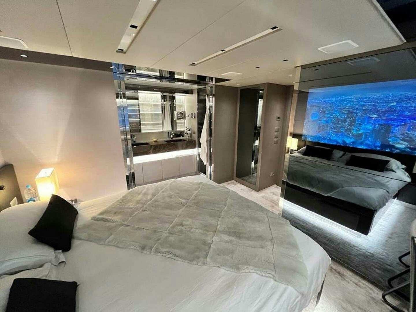 a room with a bed and a large window aboard SIGNE Yacht for Sale