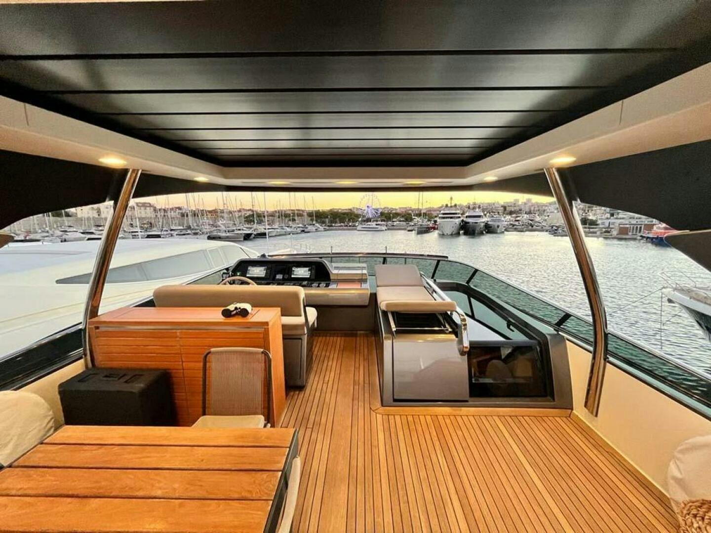a deck with a view of a city and water aboard SIGNE Yacht for Sale