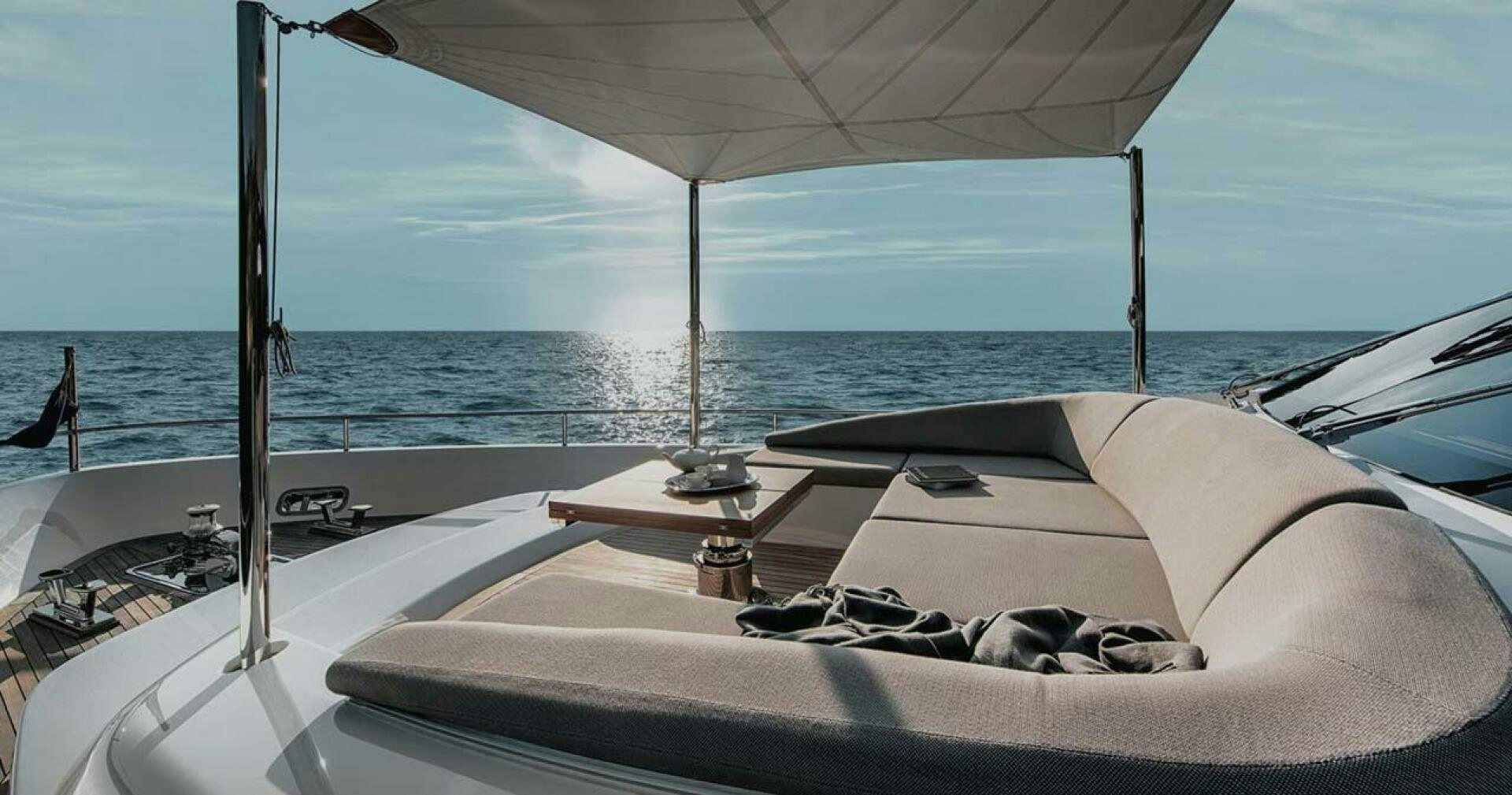 a boat with a white cover and a white umbrella on the front aboard SIGNE Yacht for Sale