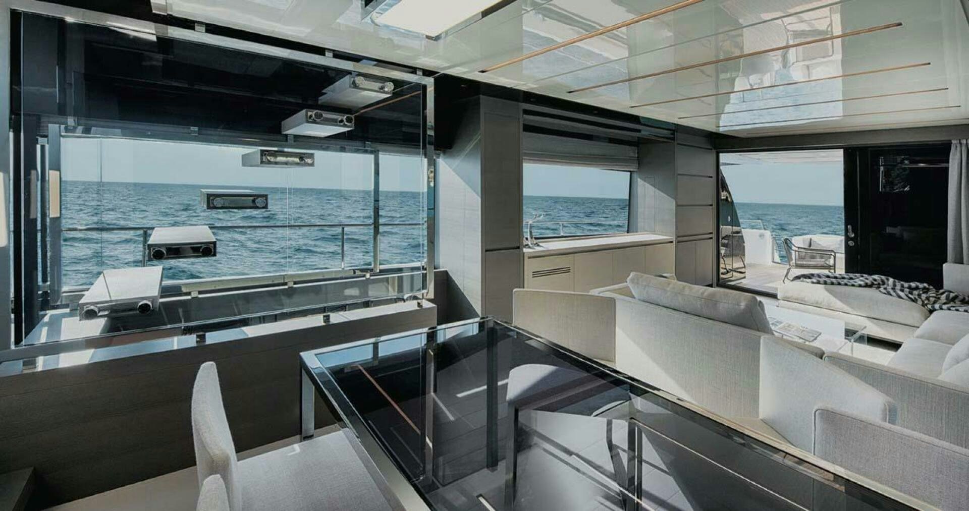 a room with a large window and a view of the ocean aboard SIGNE Yacht for Sale