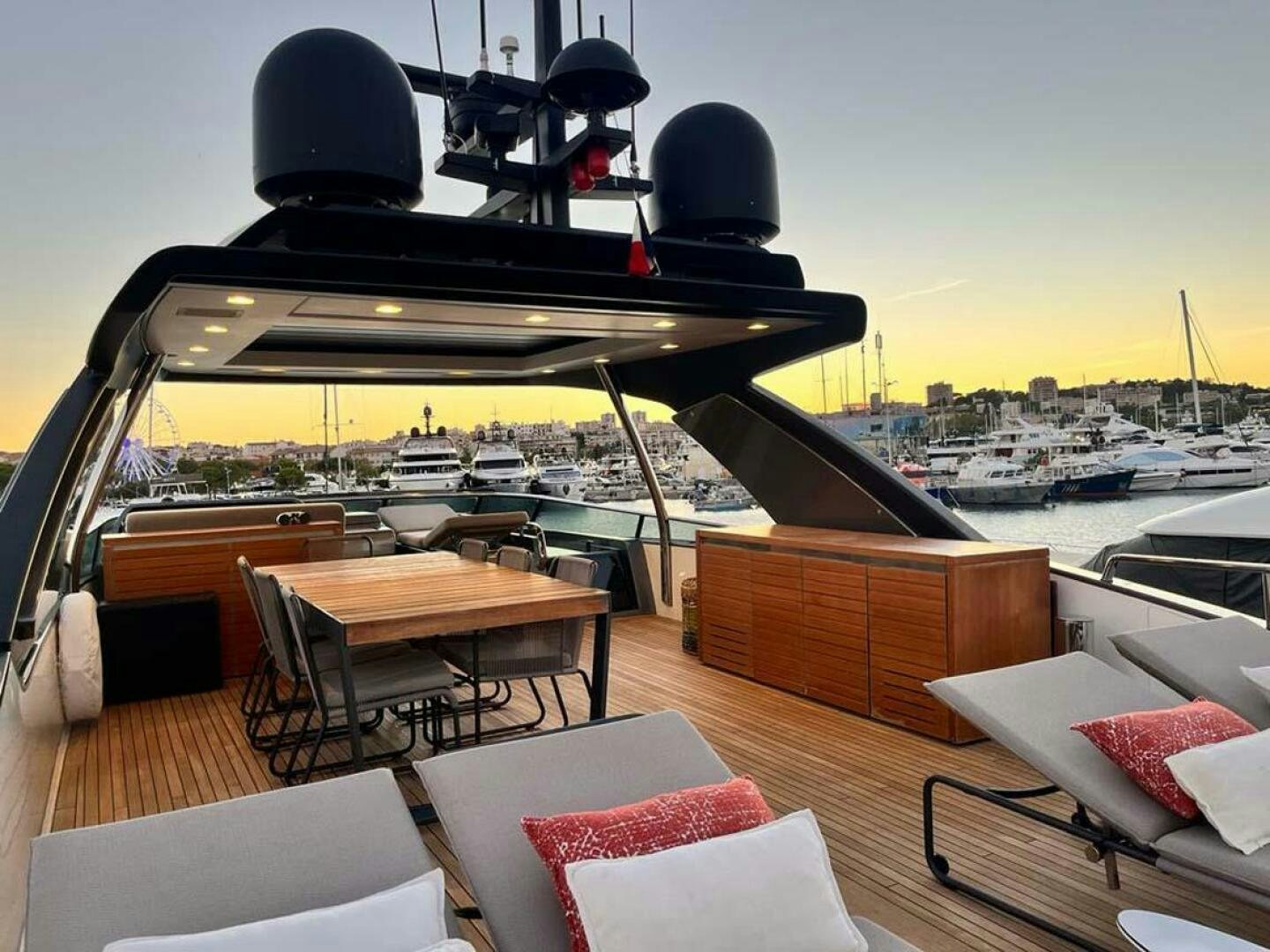 a deck with a table and chairs aboard SIGNE Yacht for Sale