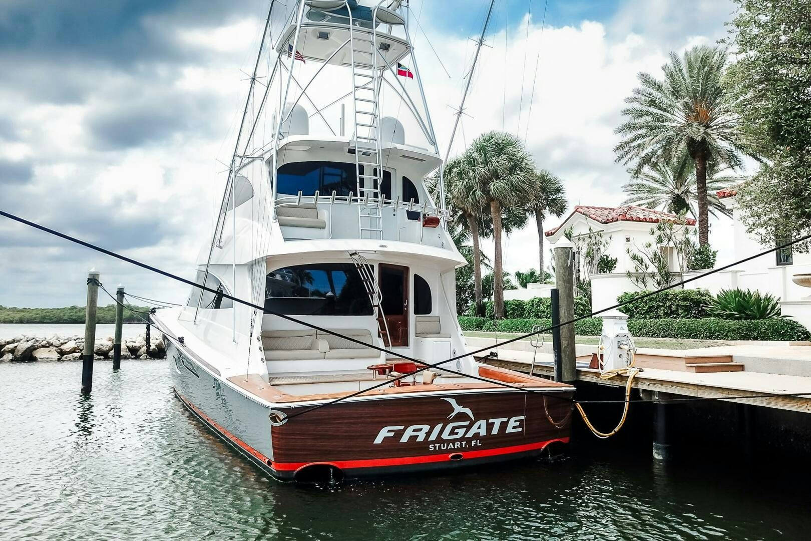 a boat docked at a pier aboard FRIGATE Yacht for Sale