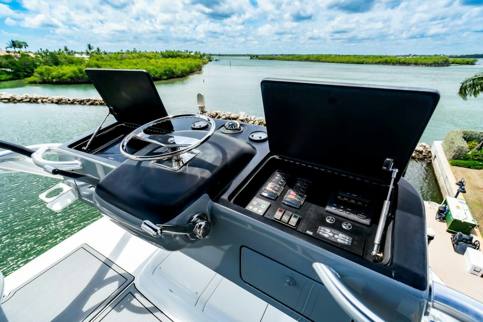 a car with a steering wheel aboard FRIGATE Yacht for Sale