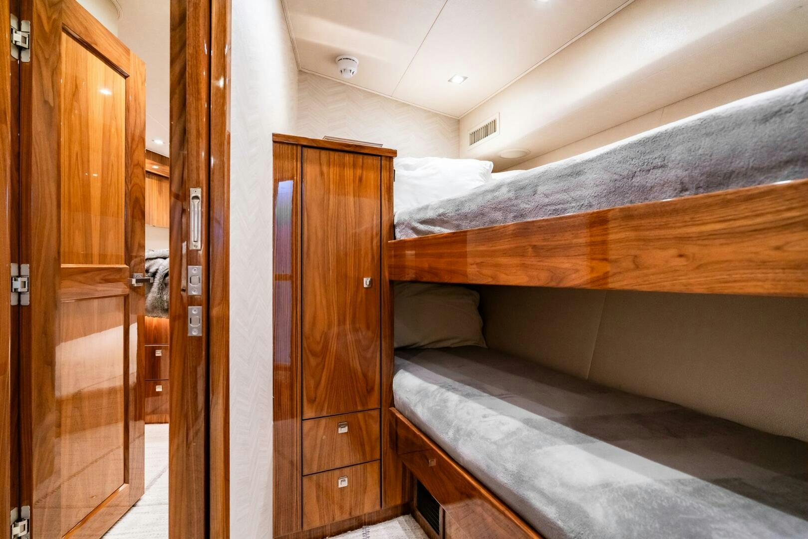 a room with wooden furniture aboard FRIGATE Yacht for Sale