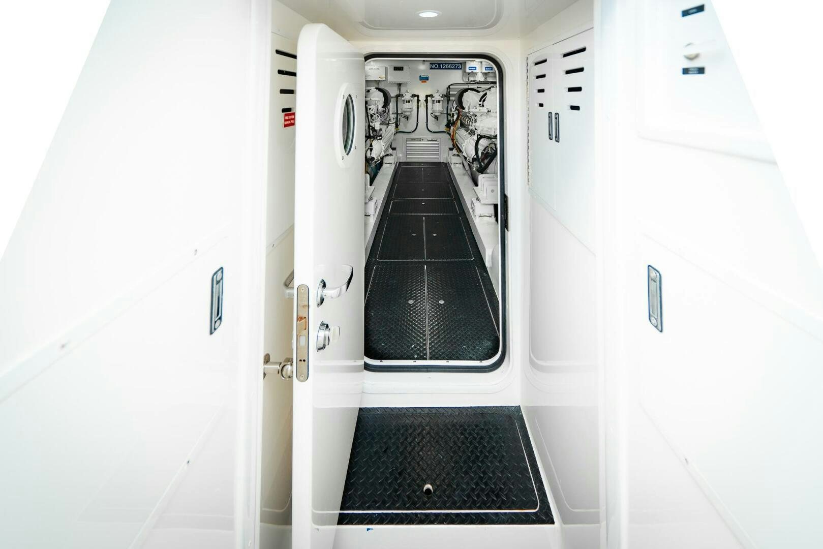 a hallway with white doors aboard FRIGATE Yacht for Sale