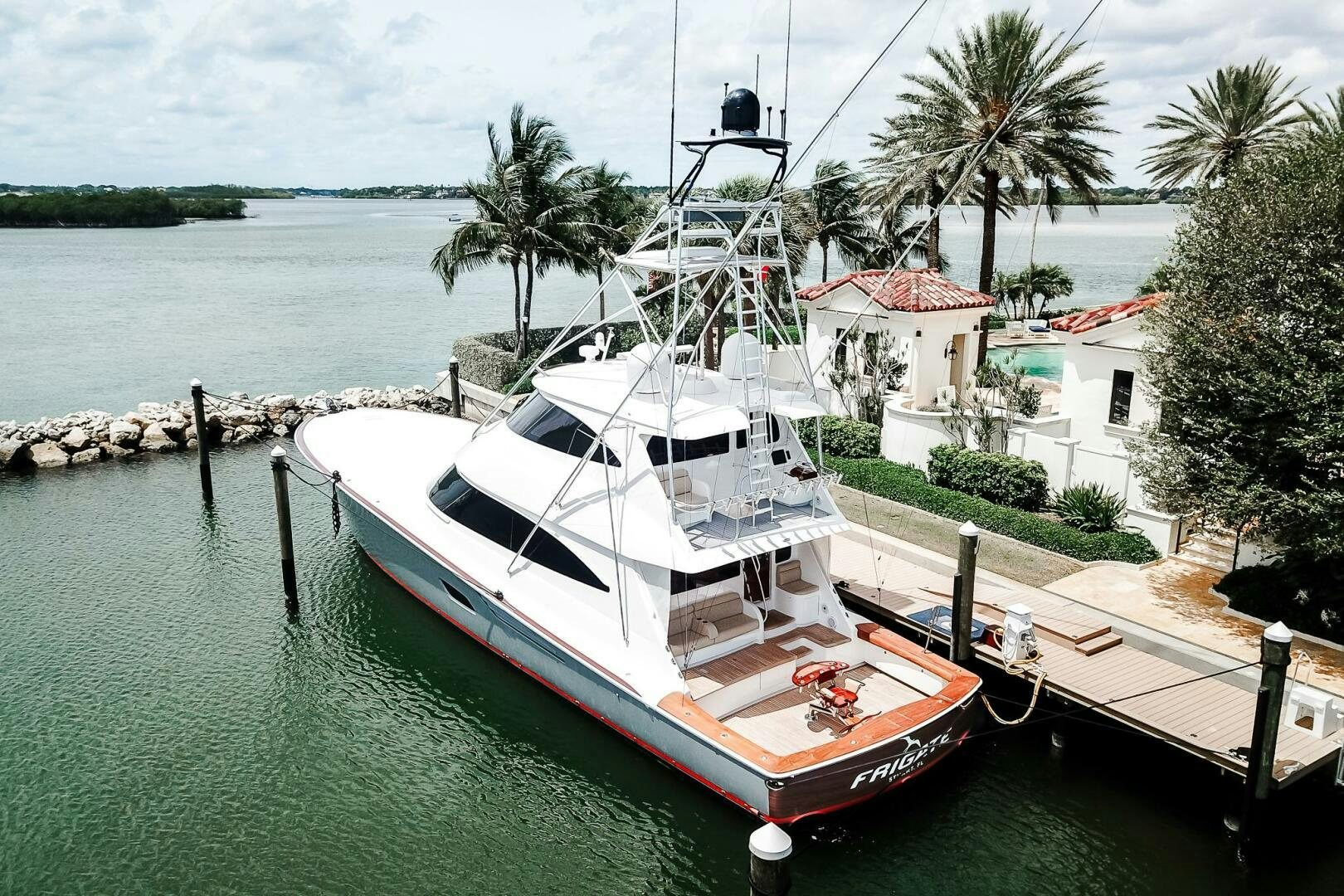 a boat docked at a pier aboard FRIGATE Yacht for Sale