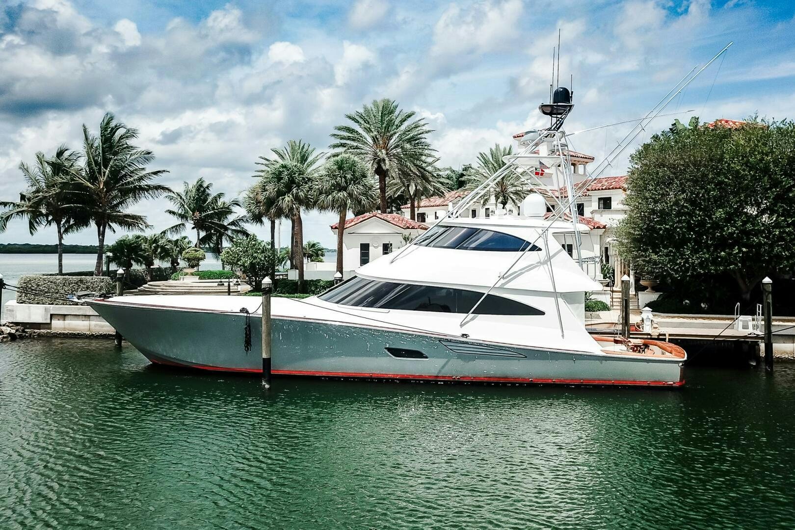 a boat docked at a pier aboard FRIGATE Yacht for Sale