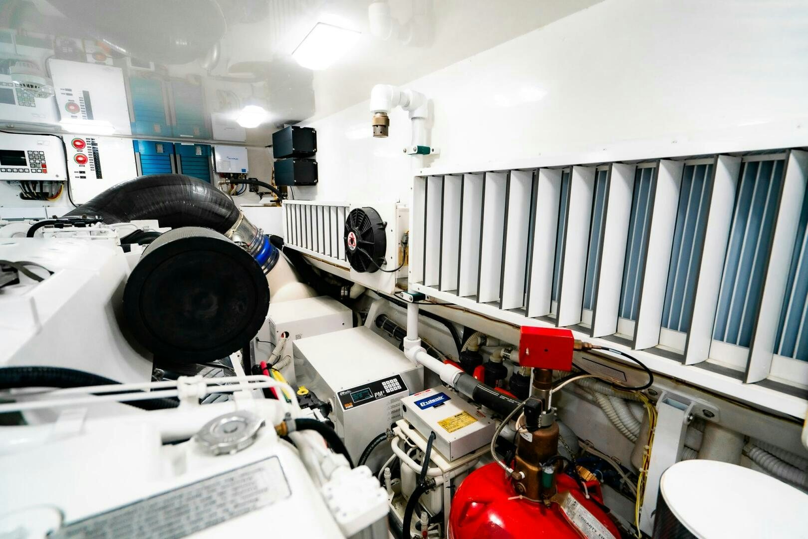 a room with a machine and a window aboard FRIGATE Yacht for Sale