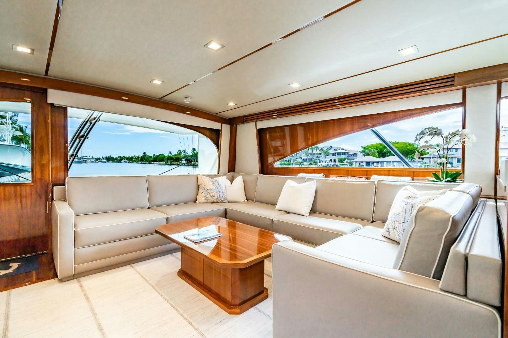 a living room with a couch and a table aboard FRIGATE Yacht for Sale