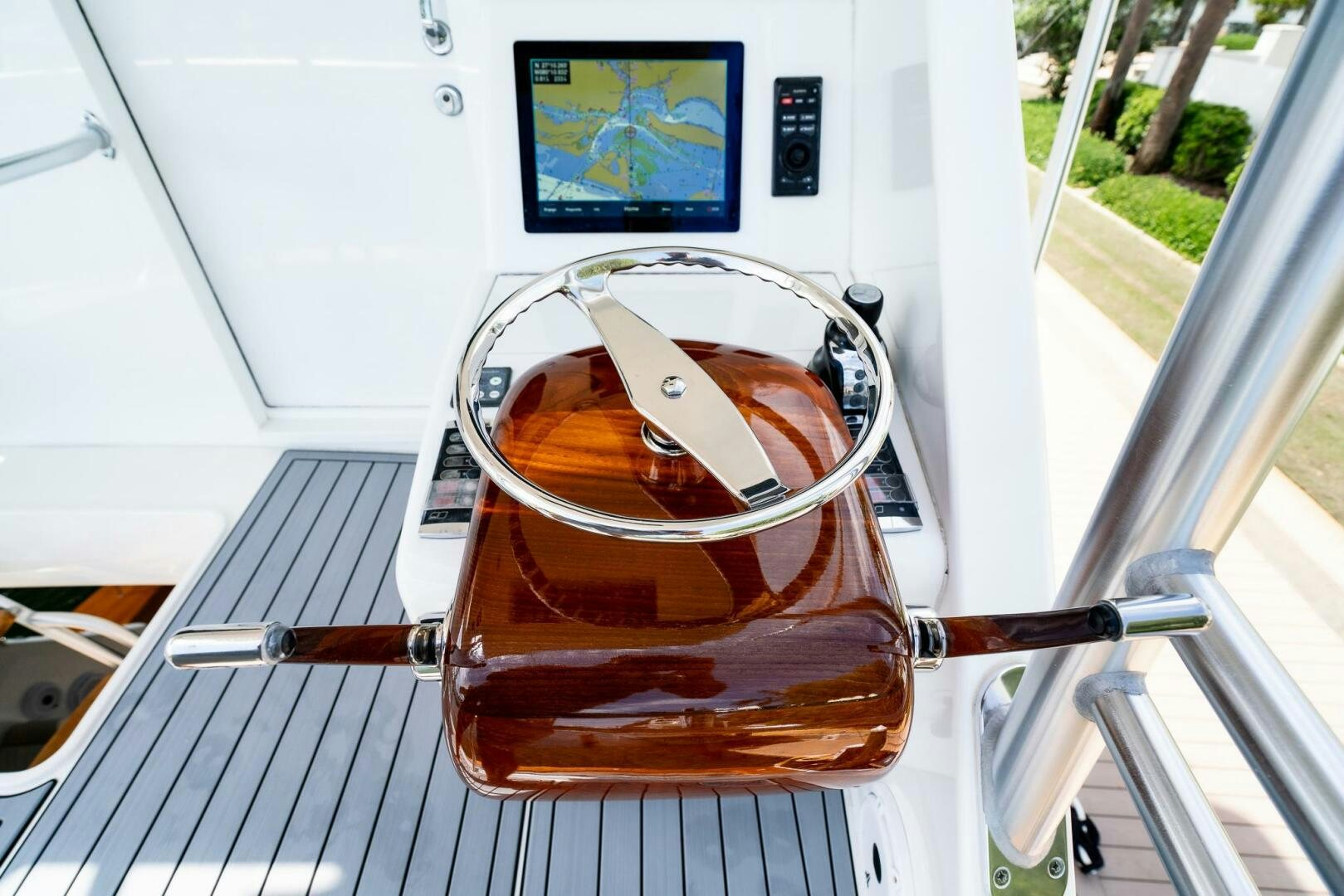 a glass of beer on a metal bar on a white table aboard FRIGATE Yacht for Sale