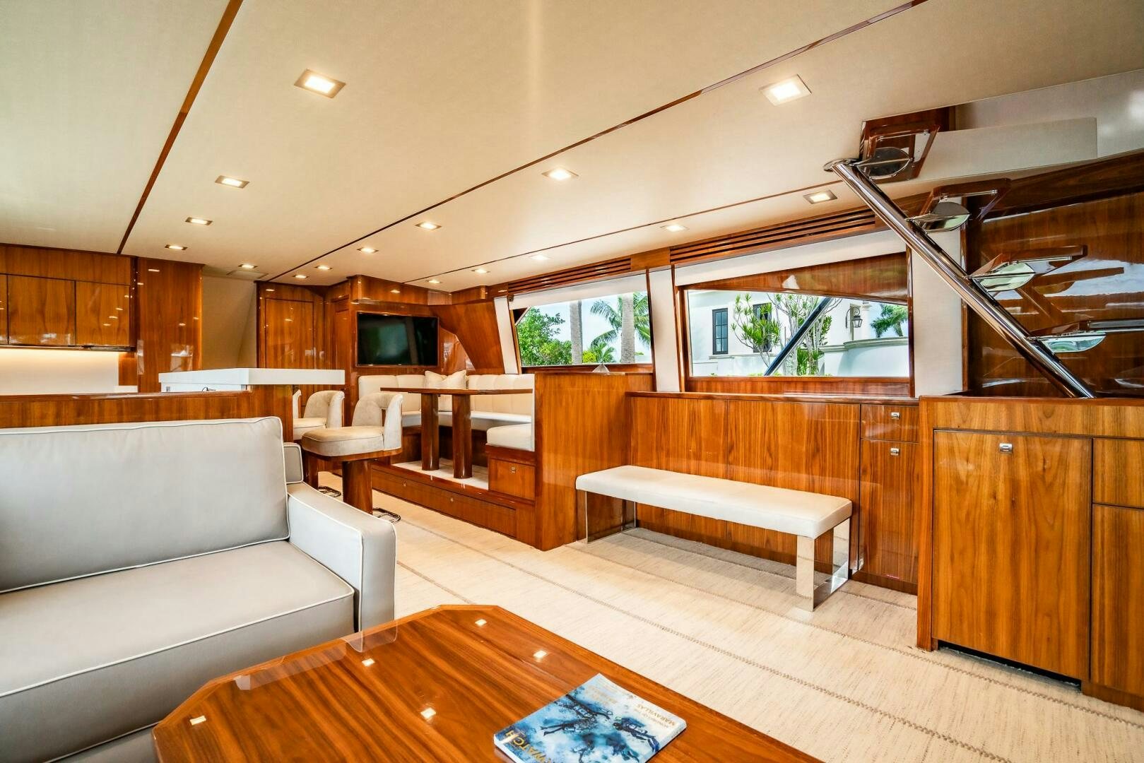 a living room with a wood floor aboard FRIGATE Yacht for Sale