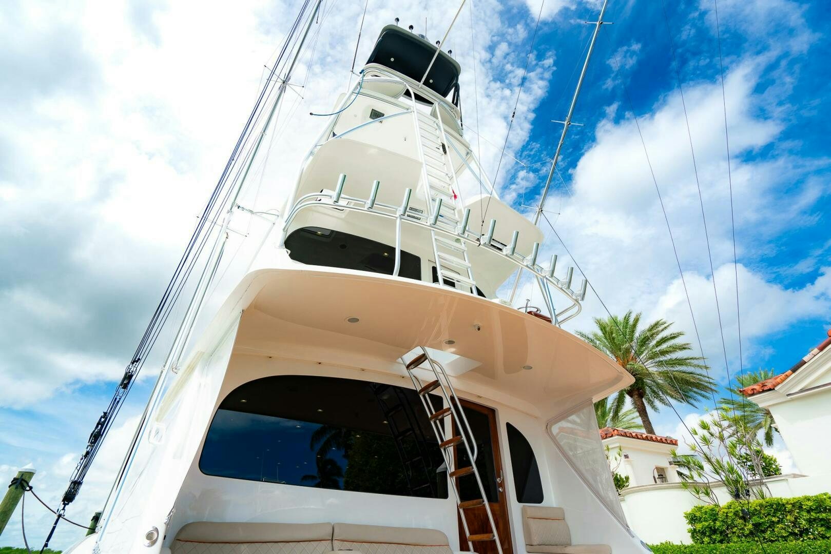 a white boat on a dock aboard FRIGATE Yacht for Sale