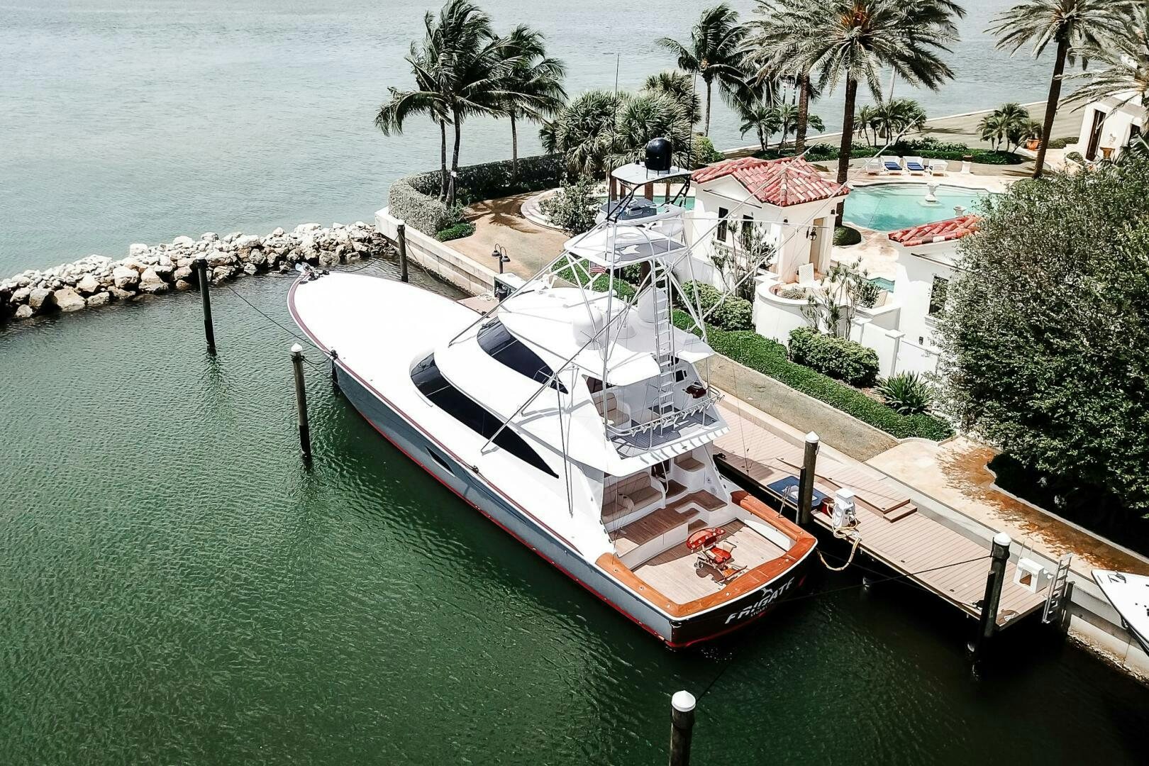 a boat docked at a pier aboard FRIGATE Yacht for Sale