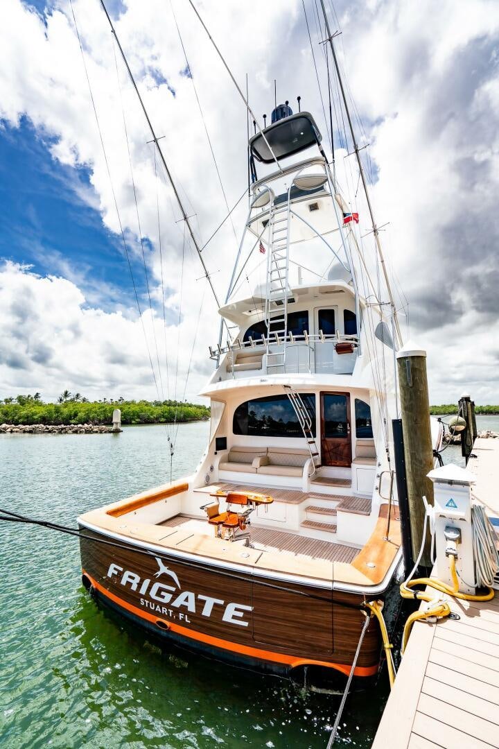 a boat docked at a pier aboard FRIGATE Yacht for Sale