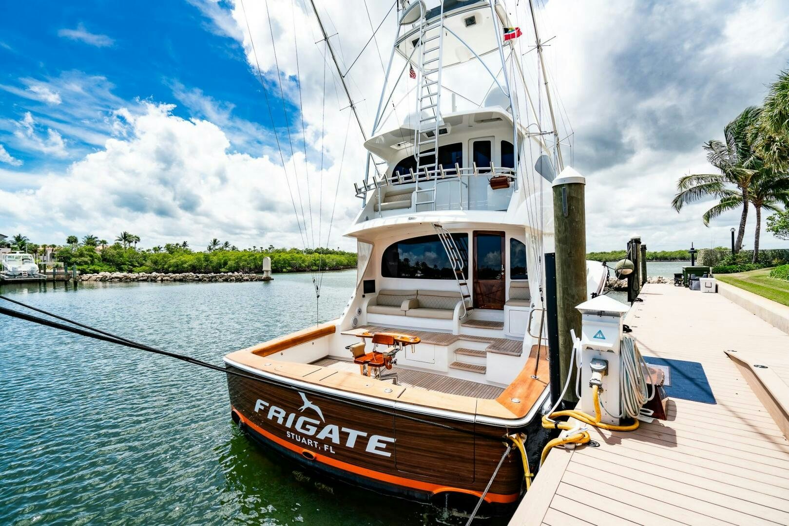 a boat docked at a pier aboard FRIGATE Yacht for Sale