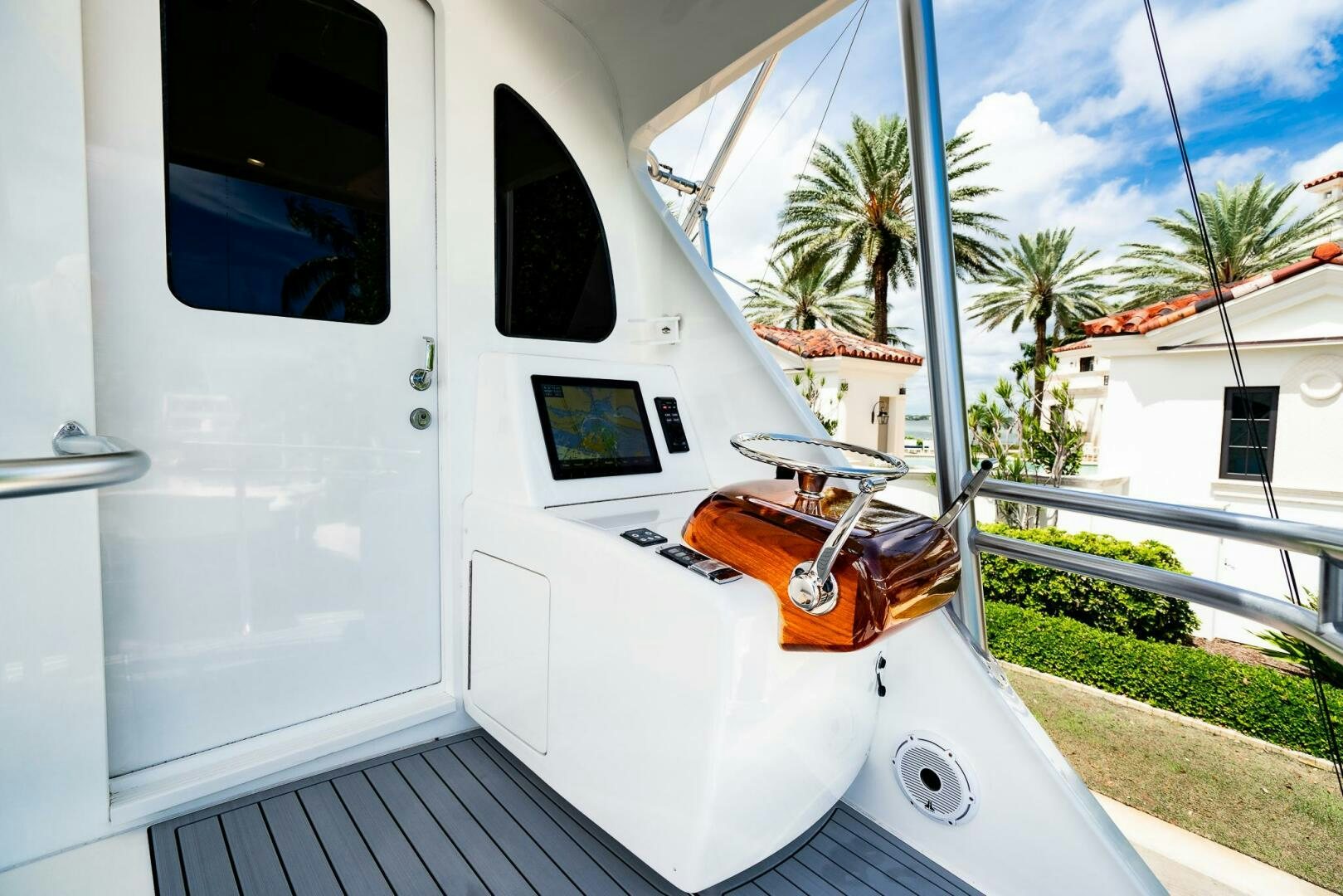 a white car with a door open aboard FRIGATE Yacht for Sale