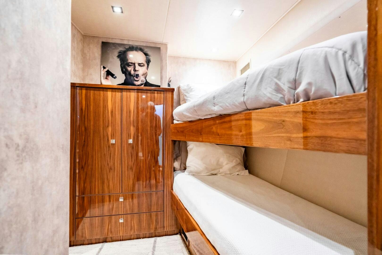a bed with a wooden headboard aboard FRIGATE Yacht for Sale