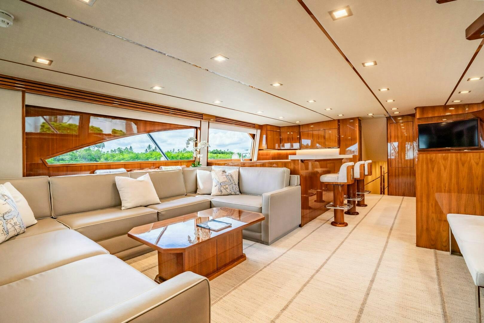 a living room with a large window aboard FRIGATE Yacht for Sale