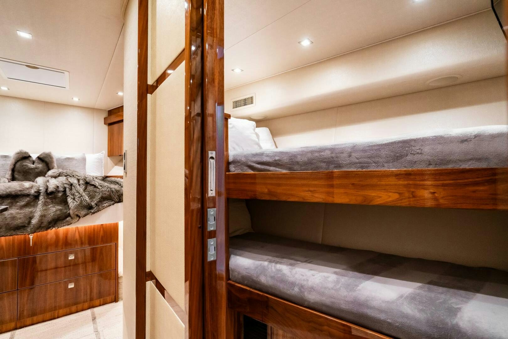 a bunk bed with a wood frame aboard FRIGATE Yacht for Sale