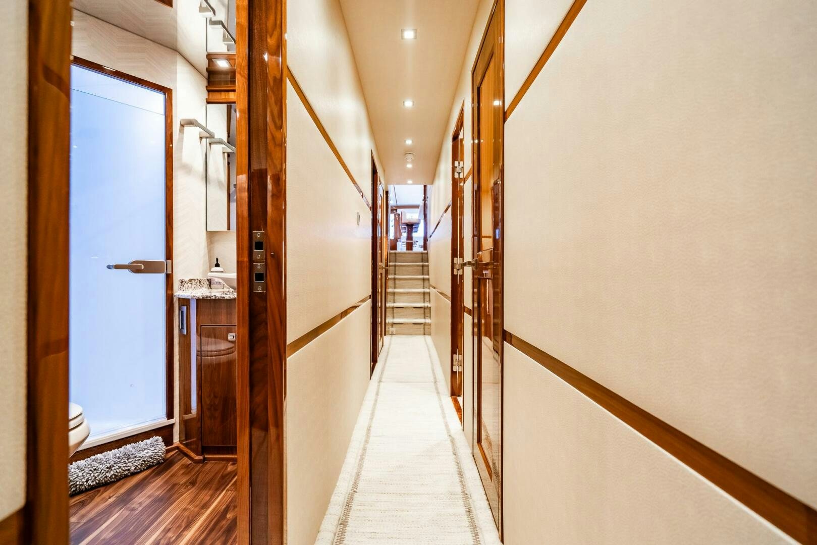 a hallway with a couple of mirrors aboard FRIGATE Yacht for Sale