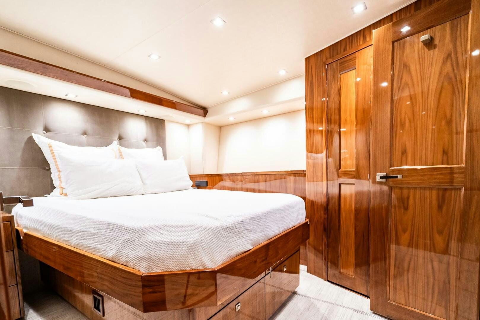 a bed in a room aboard FRIGATE Yacht for Sale