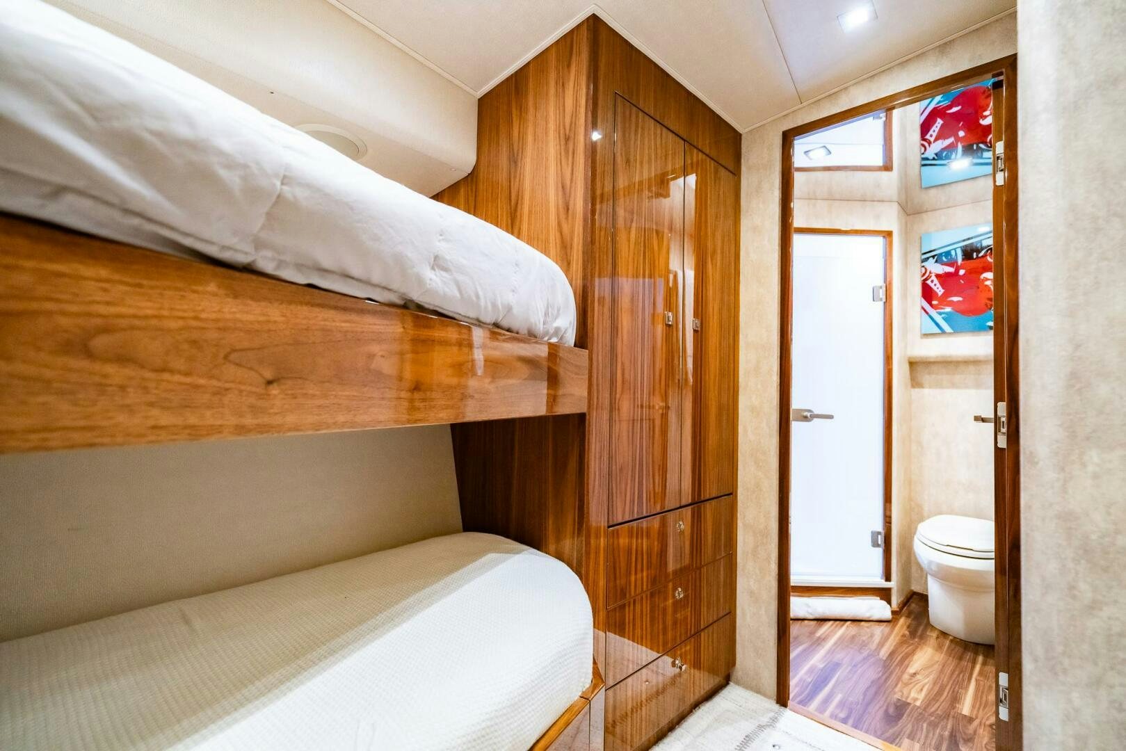 a room with a bed and a closet aboard FRIGATE Yacht for Sale