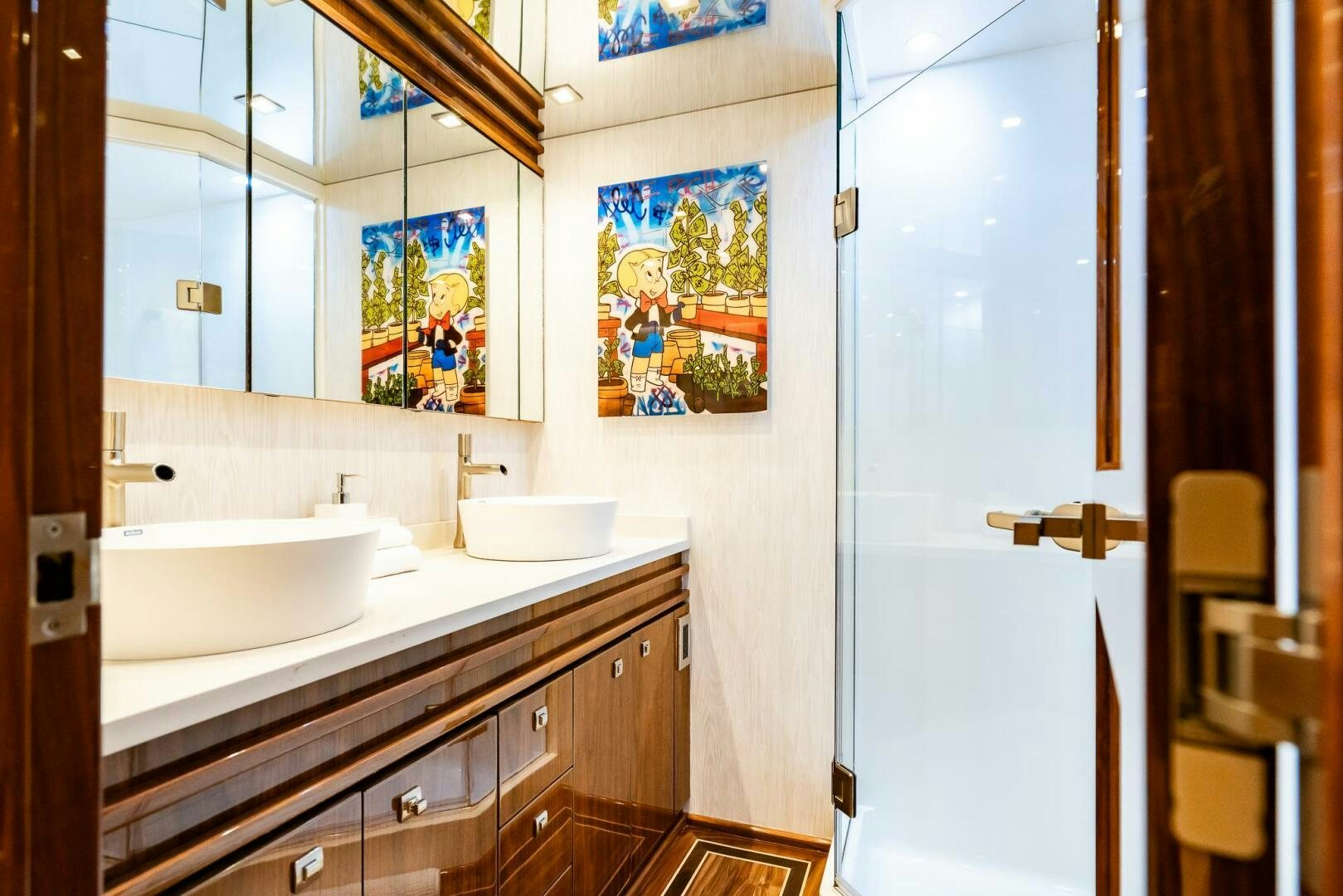 a bathroom with a large mirror aboard FRIGATE Yacht for Sale