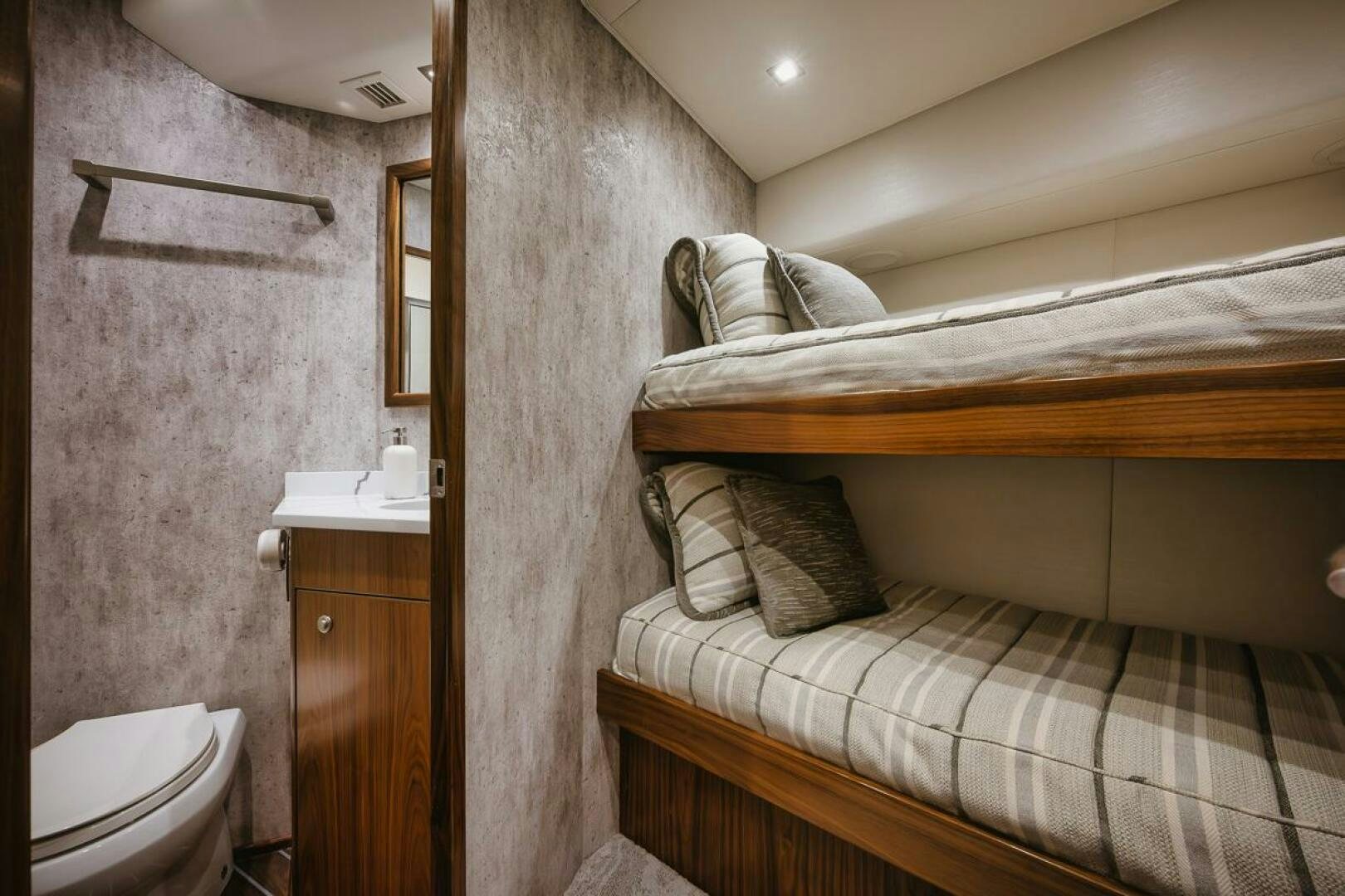 a room with a bed and a sink aboard WHIRLWIND Yacht for Sale
