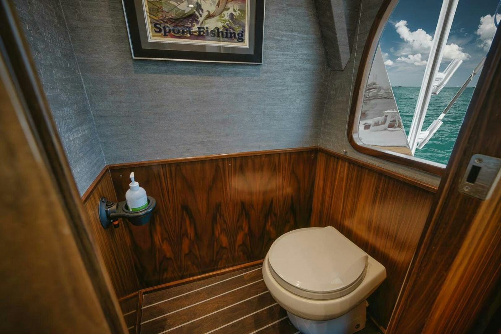 a toilet in a bathroom aboard WHIRLWIND Yacht for Sale