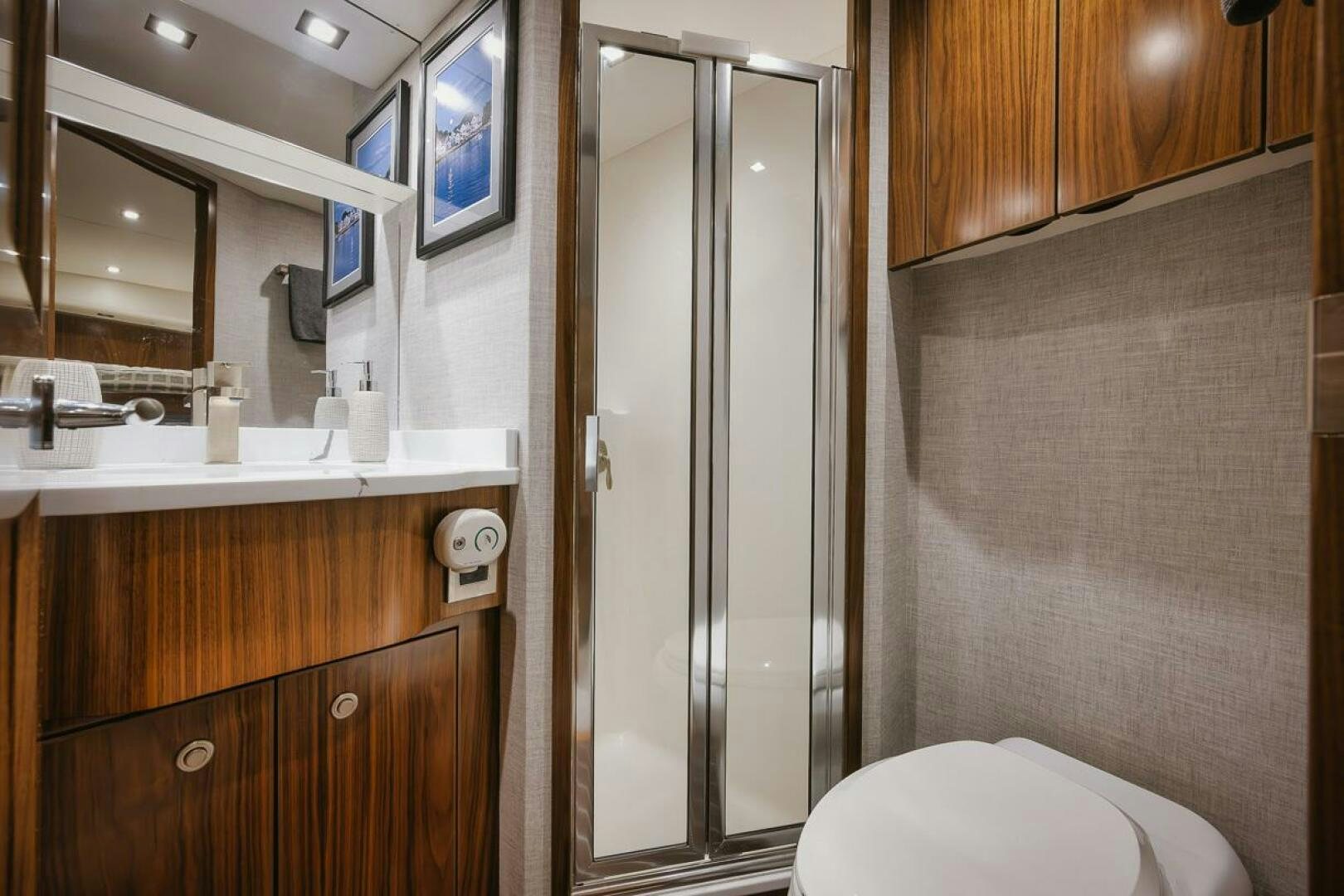 a bathroom with a glass shower aboard WHIRLWIND Yacht for Sale