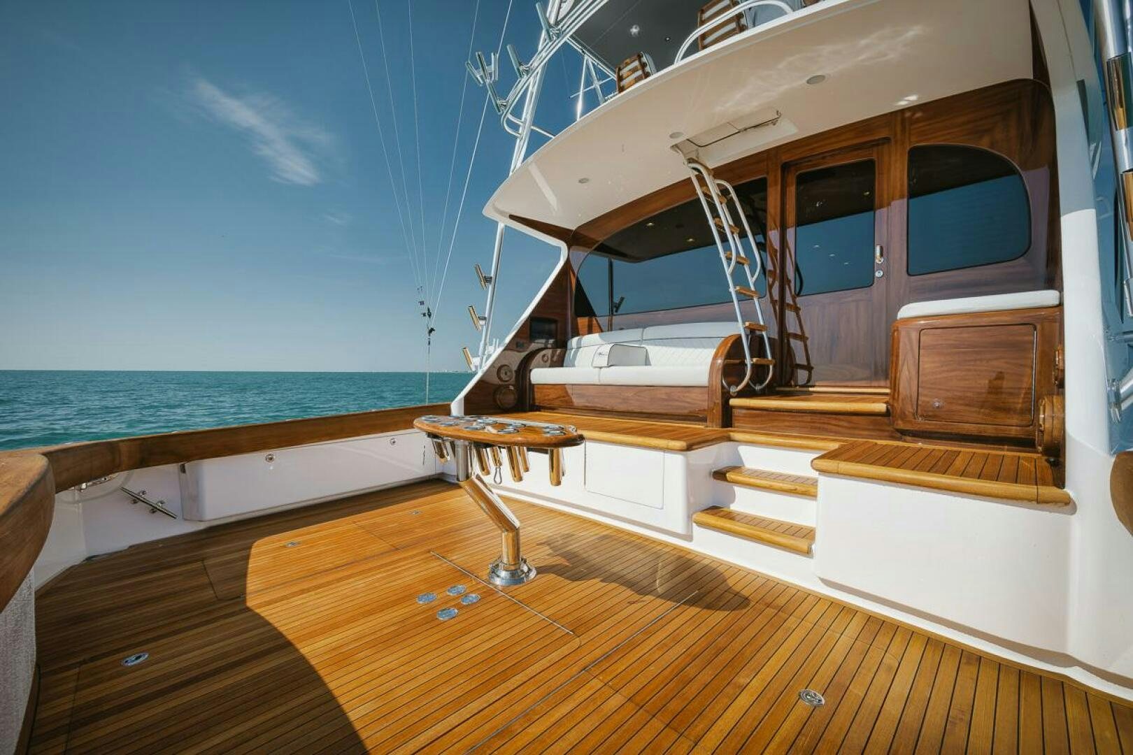 a wooden deck with a large window and a wood floor aboard WHIRLWIND Yacht for Sale
